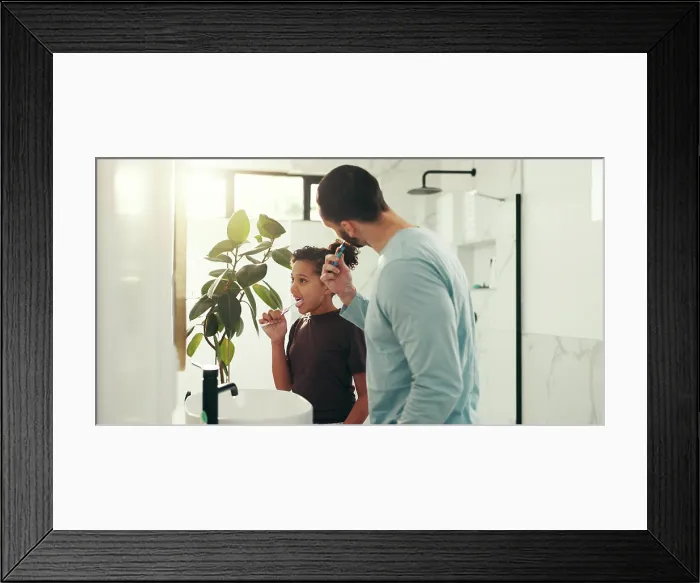 Framed Print : Child, dad and brushing teeth in bathroom for dental hygiene or morning routine together in home Framed Print : Child, dad and brushing teeth in bathroom for dental hygiene or morning routine together in home
