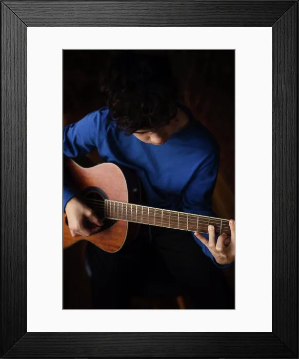 Framed Print : Teen buy plays acoustic guitar Framed Print : Teen buy plays acoustic guitar