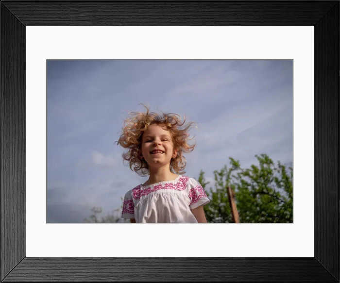 Framed Print : Beautiful blond girl with light eyes posing at camera at sunset very cheerful Framed Print : Beautiful blond girl with light eyes posing at camera at sunset very cheerful