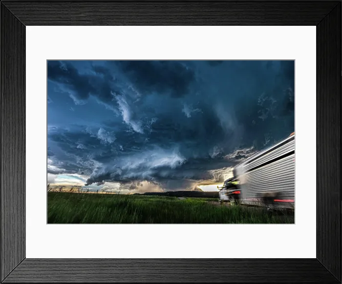 Framed Print : Moving truck heading toward a huge storm and cloud sky Framed Print : Moving truck heading toward a huge storm and cloud sky