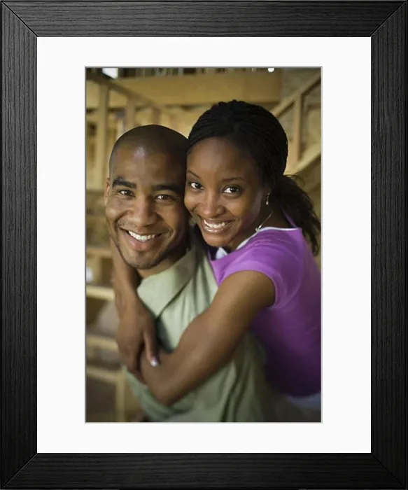 Framed Print : Portrait of a young woman embracing a young man from behind Framed Print : Portrait of a young woman embracing a young man from behind