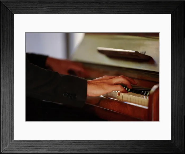 Framed Print : Hands, piano keys and music for performance