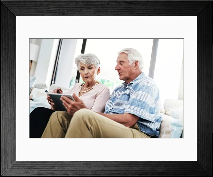 Framed Print : Senior couple, house and tablet with credit card on sofa for online shopping Framed Print : Senior couple, house and tablet with credit card on sofa for online shopping