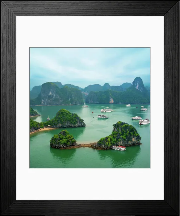 Framed Print : Tourist junks in Ha Long Bay, Vietnam Tourist junks floating among limestone rocks at early morning in Ha Long Bay