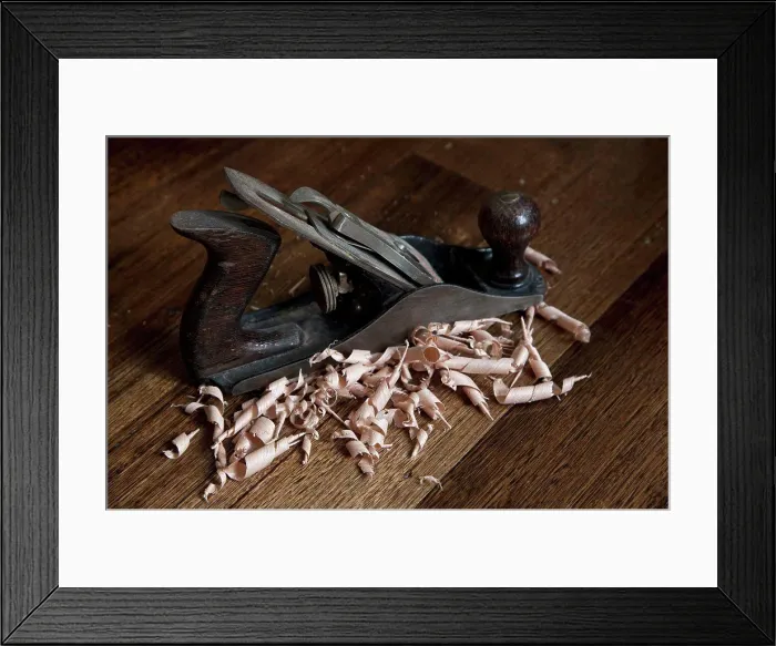 Framed Print : A wood planing tool and shavings Framed Print : A wood planing tool and shavings