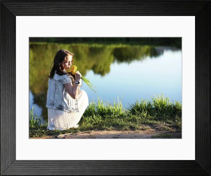 Framed Print : Girl in the park in the spring Girl in the park in the evening of a sunny day in the spring Framed Print : Girl in the park in the spring Girl in the park in the evening of a sunny day in the spring