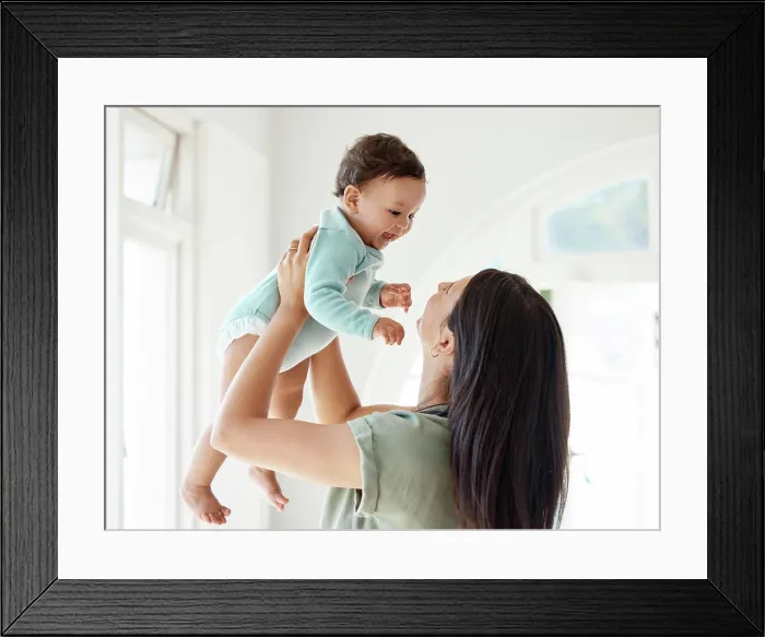 Framed Print : Mom carrying happy baby in home for love Framed Print : Mom carrying happy baby in home for love