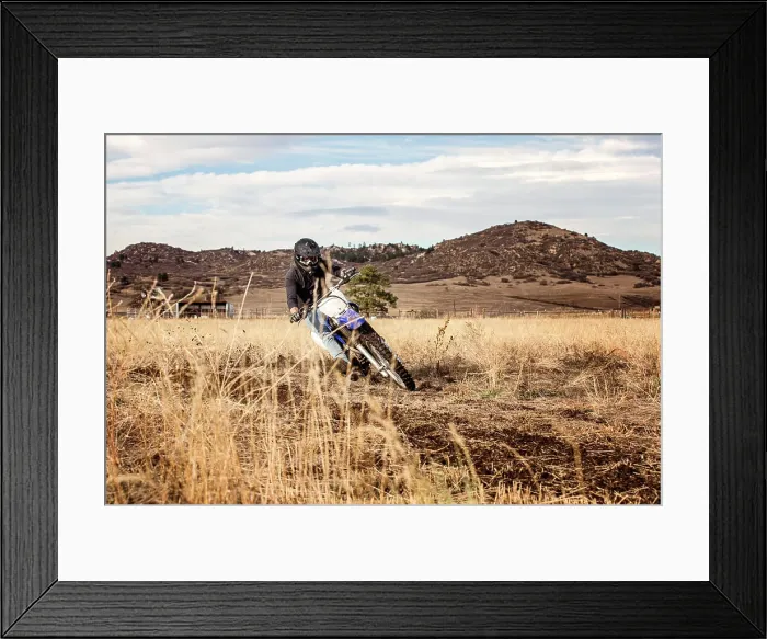 Framed Print : Young Man Dirt Biking in the Foothills in Colorado Framed Print : Young Man Dirt Biking in the Foothills in Colorado