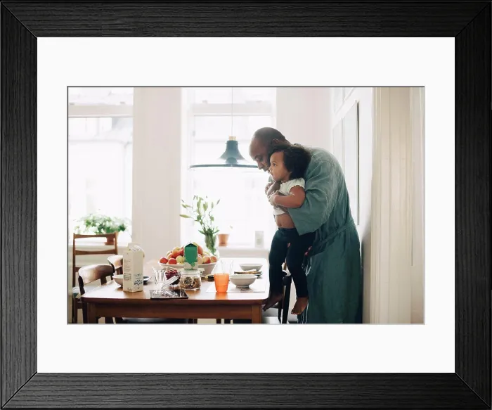 Framed Print : Father making daughter sit at table for breakfast in dining room Framed Print : Father making daughter sit at table for breakfast in dining room