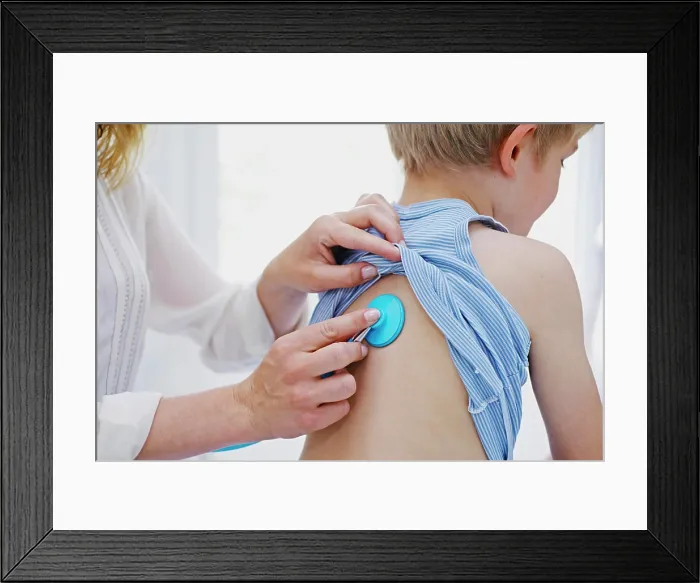 Framed Print : Doctor auscultating a child Framed Print : Doctor auscultating a child