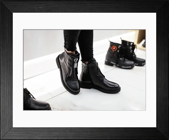 Framed Print : Boy Stylish Woman in black more fashionable jeans in fashionable leather boots is at the white at shop trendy Framed Print : Boy Stylish Woman in black more fashionable jeans in fashionable leather boots is at the white at shop trendy