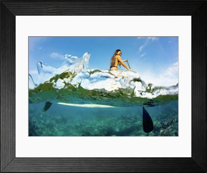 Framed Print : Split image of above and below water and a woman on a stand up paddle board; Hawaii, United States of America Framed Print : Split image of above and below water and a woman on a stand up paddle board; Hawaii, United States of America