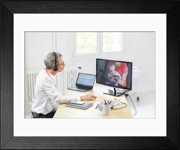 Framed Print : Pediatric video consultation for a child with a high temperature Framed Print : Pediatric video consultation for a child with a high temperature