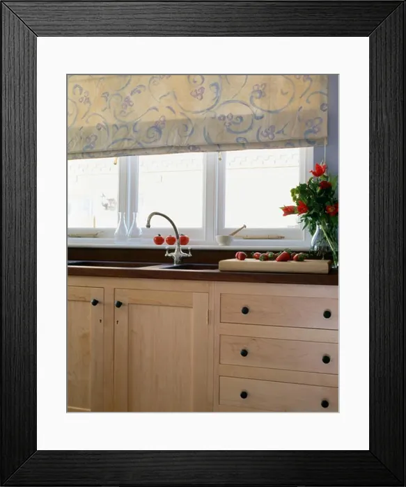 Framed Print : Floral blind on window above sink and chrome tap in fitted unit Framed Print : Floral blind on window above sink and chrome tap in fitted unit