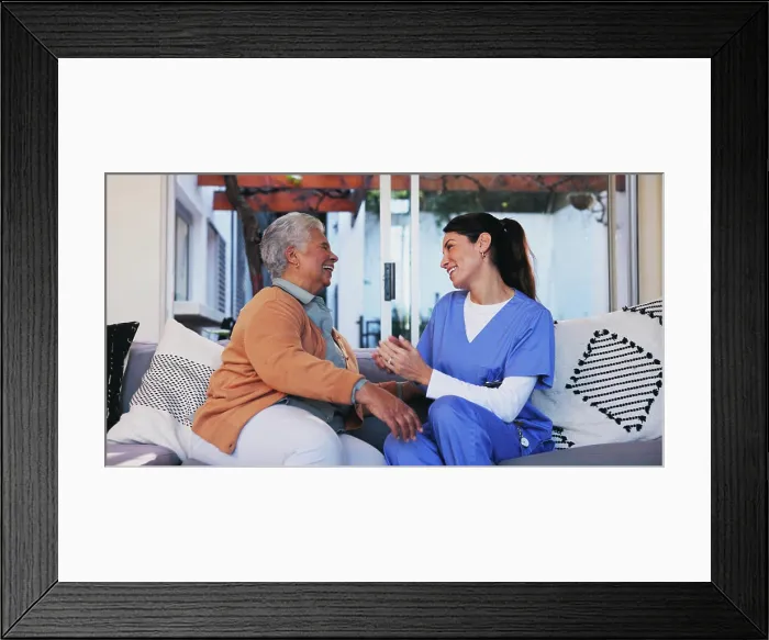 Framed Print : Senior, woman and nurse with conversation on sofa for healthcare support