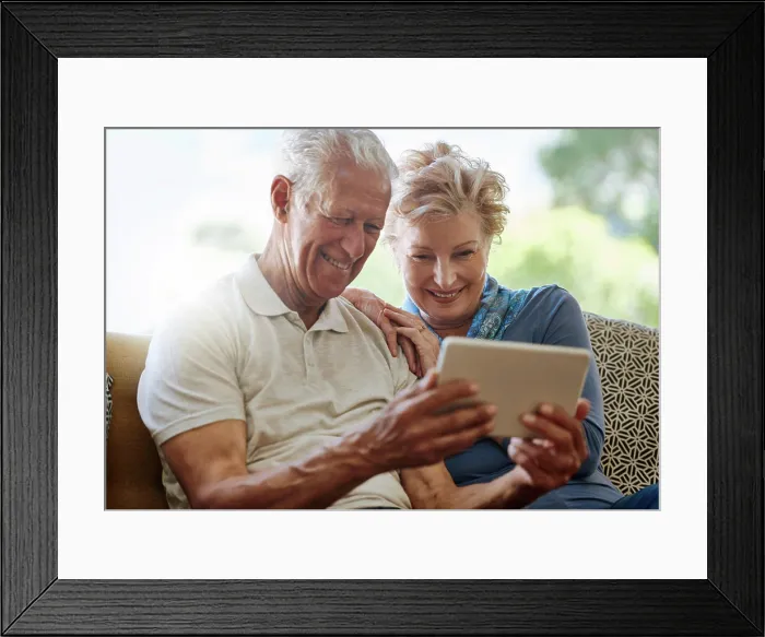 Framed Print : Mature couple, lounge and streaming with tablet Framed Print : Mature couple, lounge and streaming with tablet