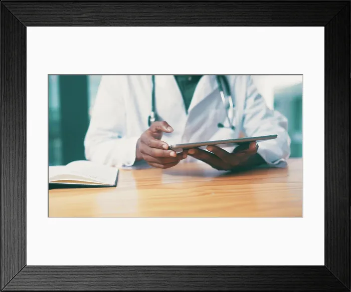 Framed Print : Tablet, notebook and hands of doctor in clinic with medical research for treatment planning