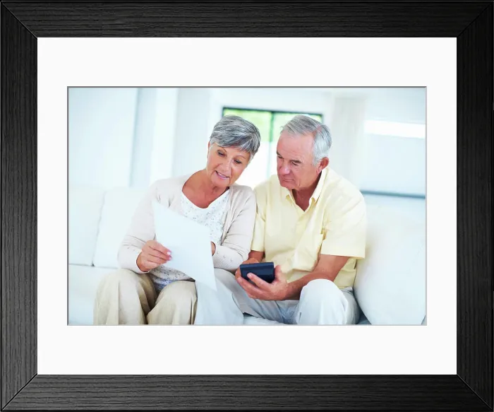 Framed Print : Senior, couple and documents with calculator on sofa with budget planning Framed Print : Senior, couple and documents with calculator on sofa with budget planning