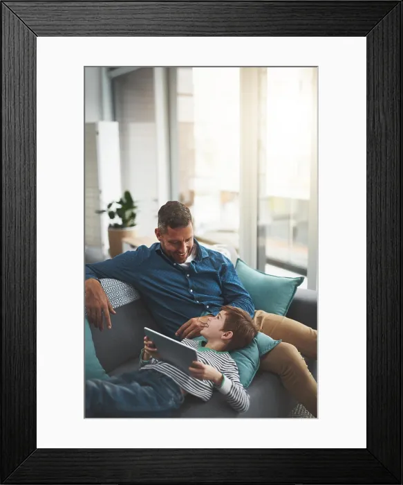 Framed Print : Dad, smile and child with tablet on sofa for online movie Framed Print : Dad, smile and child with tablet on sofa for online movie