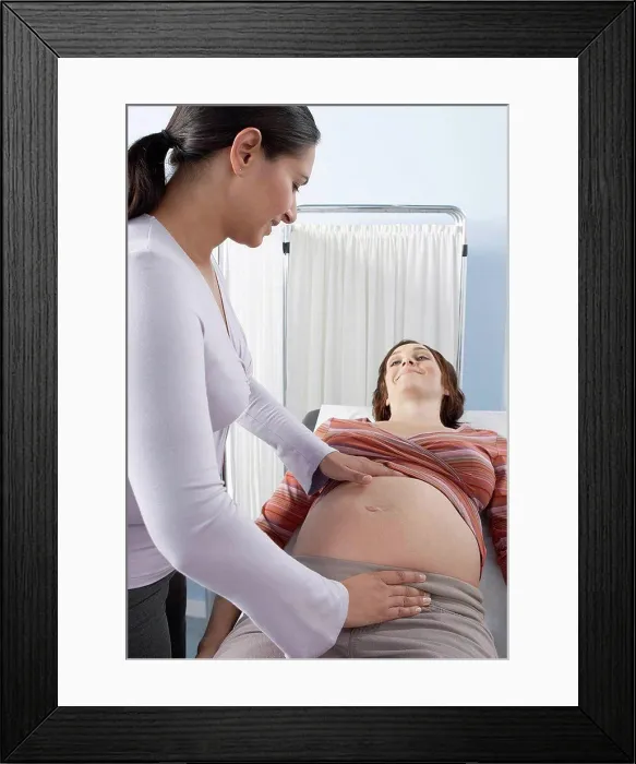 Framed Print : Obstetric examination Framed Print : Obstetric examination