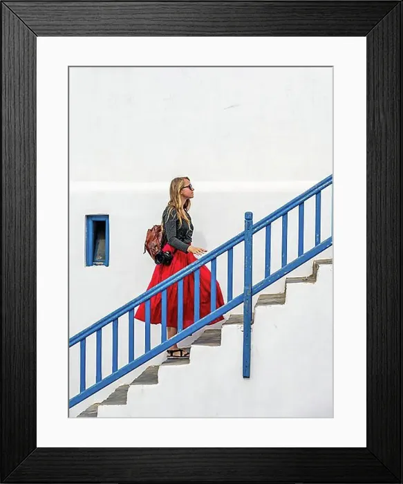 Framed Print : Young woman with red skirt on a staircase with blue banister Framed Print : Young woman with red skirt on a staircase with blue banister