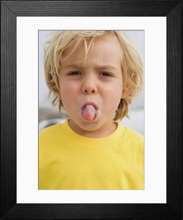 Framed Print : Boy sticking out tongue Framed Print : Boy sticking out tongue