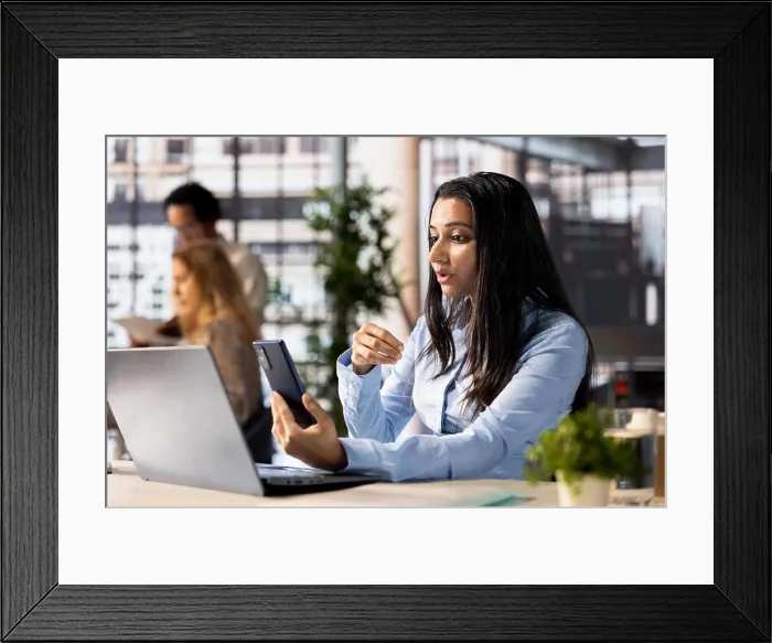 Framed Print : Company executive hosts an online meeting to discuss business operations and performance metrics