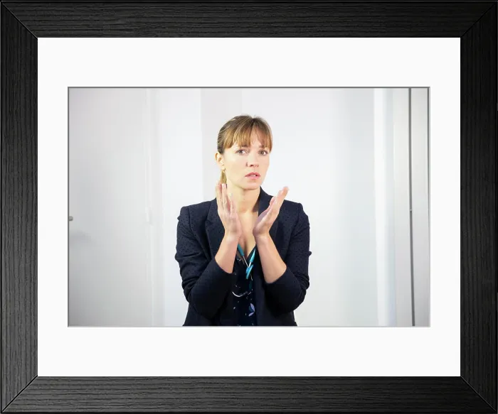 Framed Print : A female doctor talking and listening to a patient Framed Print : A female doctor talking and listening to a patient