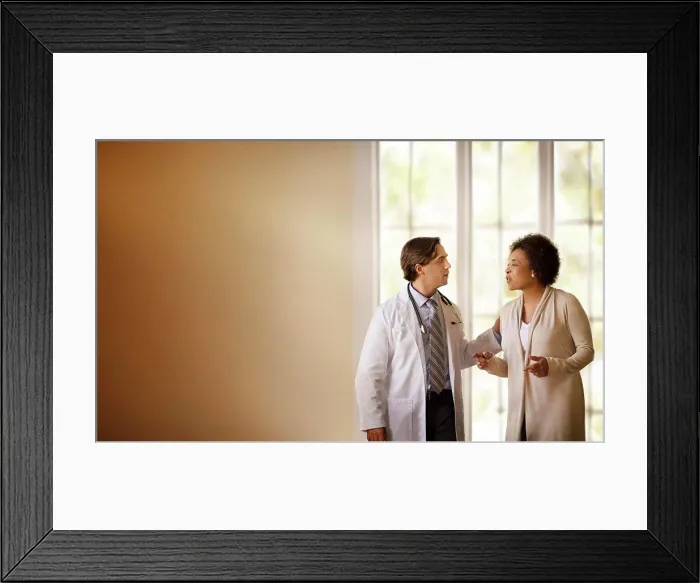 Framed Print : Doctor talking to a patient in a hospital room Framed Print : Doctor talking to a patient in a hospital room