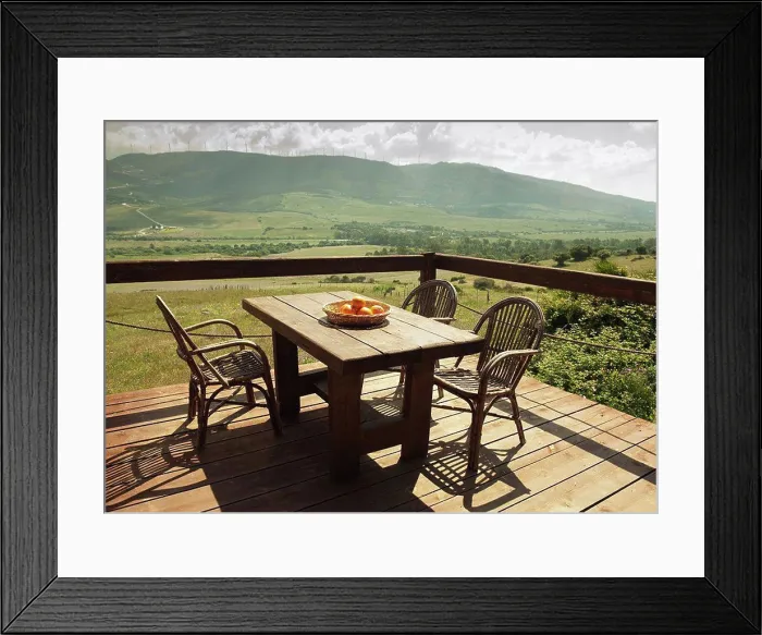 Framed Print : tarifa, cadiz, andalusia, spain, a table and chairs set on a terrace with a beautiful view of the landscape Framed Print : tarifa, cadiz, andalusia, spain, a table and chairs set on a terrace with a beautiful view of the landscape