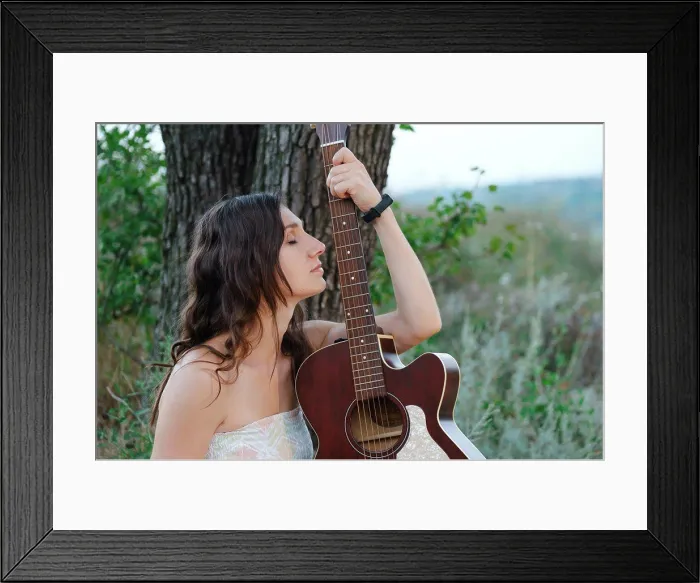 Framed Print : Girl posing with guitar. Romantic pretty girl sitting with guitar Framed Print : Girl posing with guitar. Romantic pretty girl sitting with guitar