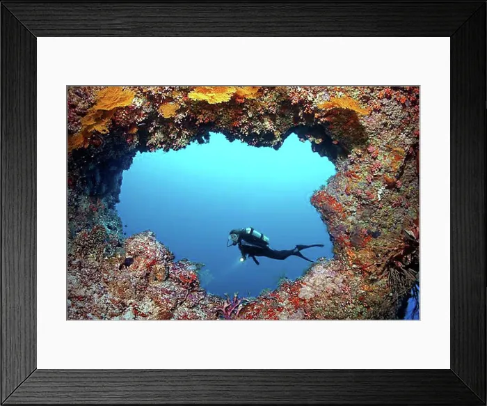 Framed Print : Scuba diver diving in front of a cave entrance, Lhaviyani Atoll, Indian Ocean, Maldives, Asia Framed Print : Scuba diver diving in front of a cave entrance, Lhaviyani Atoll, Indian Ocean, Maldives, Asia