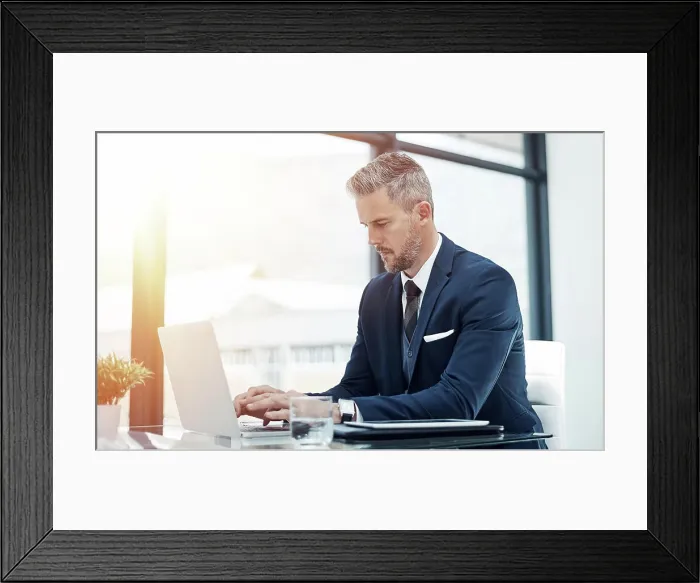 Framed Print : Finance, businessman and typing on laptop in office for company budget report and writing cash flow statement