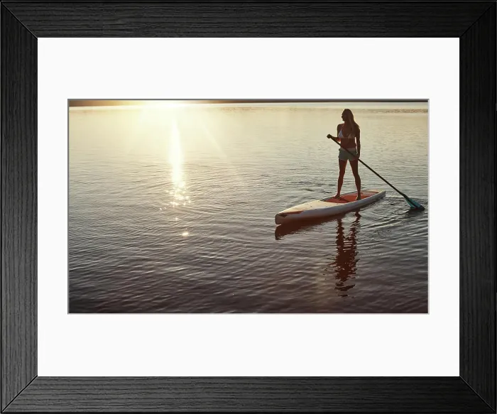 Framed Print : Lake, sunset and woman on paddle board for relax Framed Print : Lake, sunset and woman on paddle board for relax