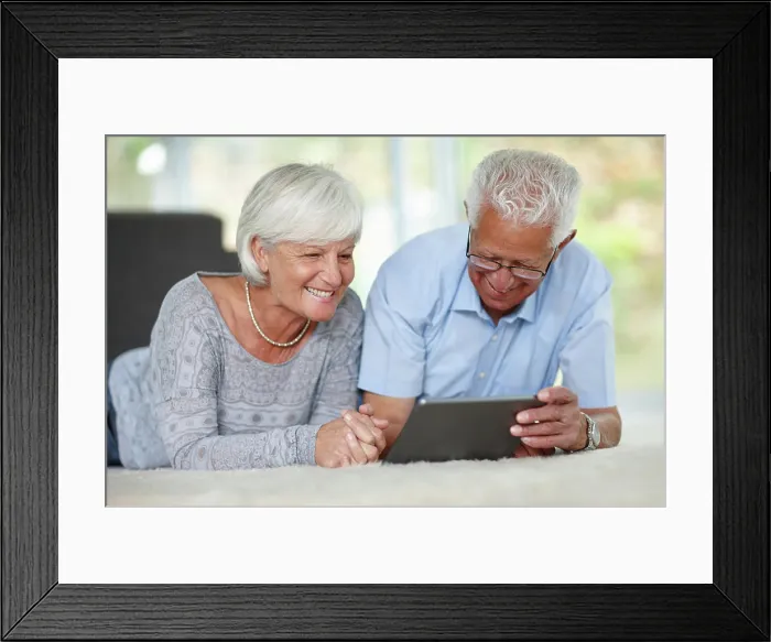 Framed Print : Senior couple, tablet or relax in home for ebook
