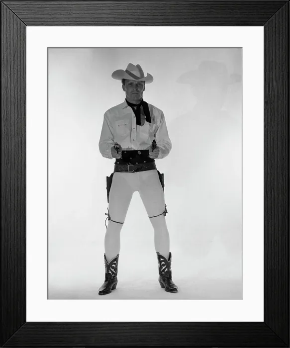 Framed Print : Mature cowboy holding guns Framed Print : Mature cowboy holding guns