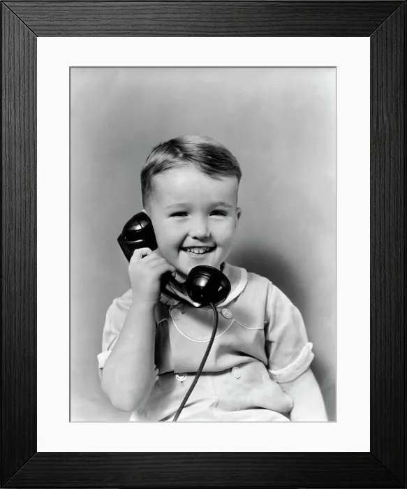 Framed Print : 1930S Little Boy Smiling Talking On Telephone Framed Print : 1930S Little Boy Smiling Talking On Telephone