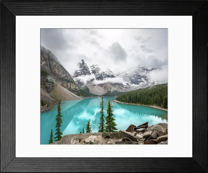 Framed Print : Cloudy mountain peaks, reflection in turquoise glacial lake Framed Print : Cloudy mountain peaks, reflection in turquoise glacial lake