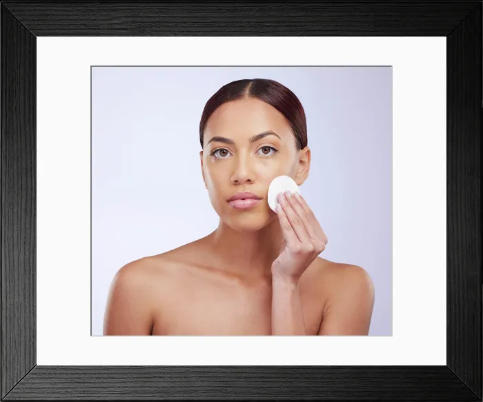 Framed Print : Portrait, skincare and cotton pad with a woman in studio on a gray background for natural treatment or beauty Framed Print : Portrait, skincare and cotton pad with a woman in studio on a gray background for natural treatment or beauty