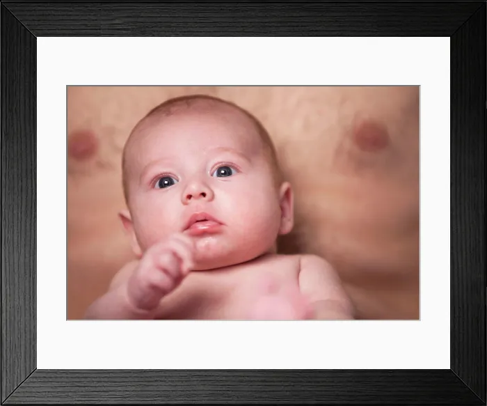 Framed Print : Baby is looking up on daddys lap Little baby boy is having a relaxing time on his white blanket Framed Print : Baby is looking up on daddys lap Little baby boy is having a relaxing time on his white blanket