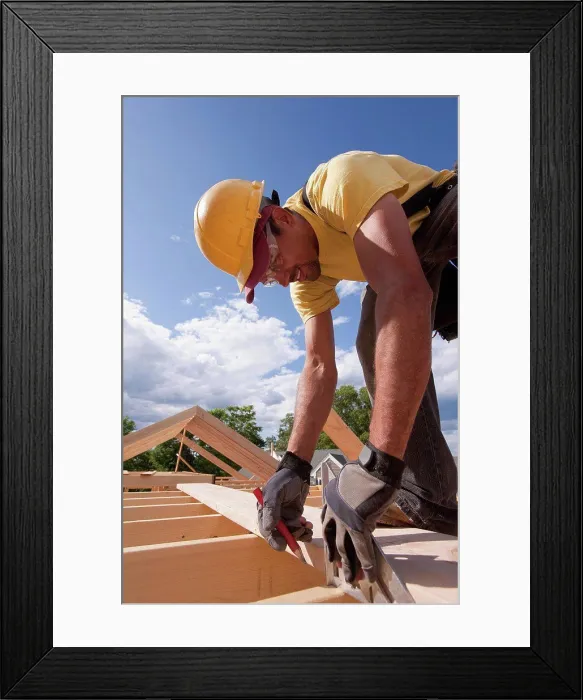 Framed Print : Carpenter marking spacing of rafters with a pencil