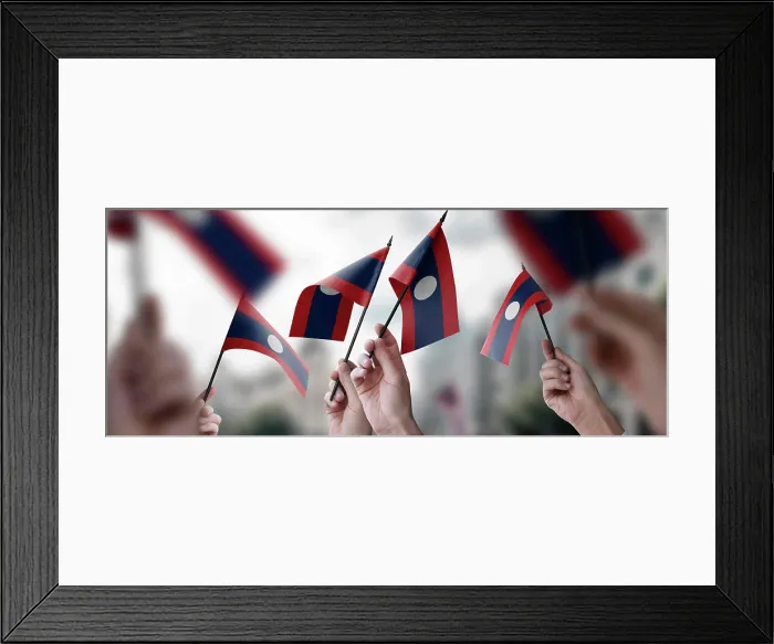 Framed Print : A group of people holding small flags of the Laos in their hands A group of people holding small flags of the Laos Framed Print : A group of people holding small flags of the Laos in their hands A group of people holding small flags of the Laos
