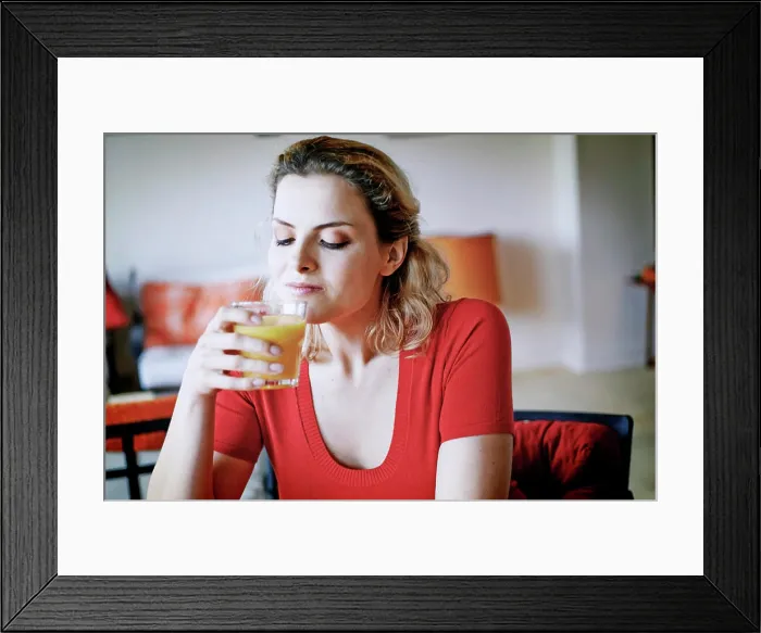 Framed Print : Woman drinking orange juice Framed Print : Woman drinking orange juice