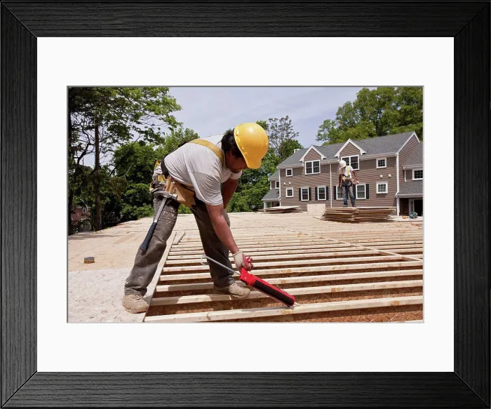Framed Print : Carpenter using a caulk gun Framed Print : Carpenter using a caulk gun