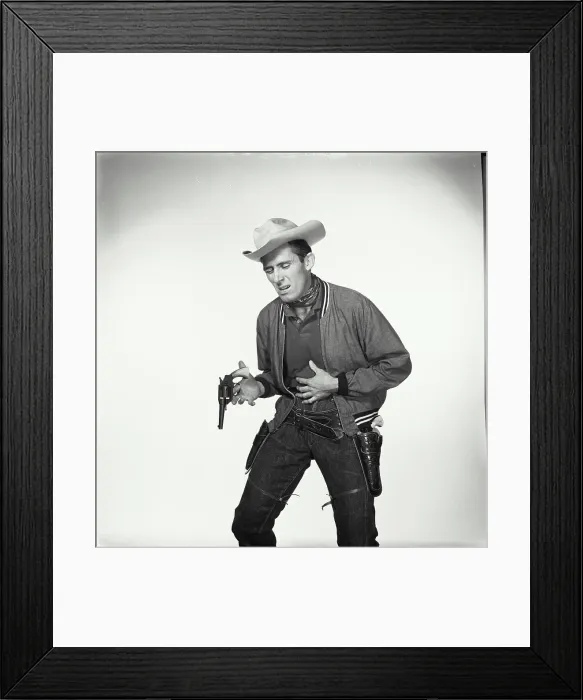 Framed Print : Cowboy pretending to be shot