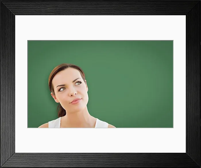 Framed Print : Attractive young mixed-race woman looking up to blank chalk board Framed Print : Attractive young mixed-race woman looking up to blank chalk board