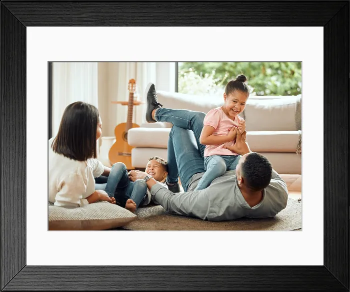 Framed Print : Playing, parents and children relax in living room for bonding Framed Print : Playing, parents and children relax in living room for bonding