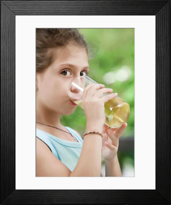 Framed Print : drink portrait of nice little girl drinking juice in summer environment Framed Print : drink portrait of nice little girl drinking juice in summer environment