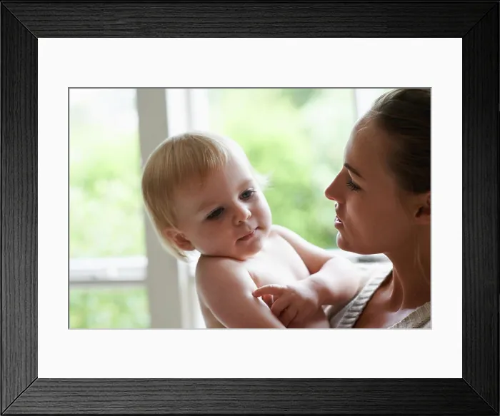 Framed Print : Mother, baby boy and house in nursery