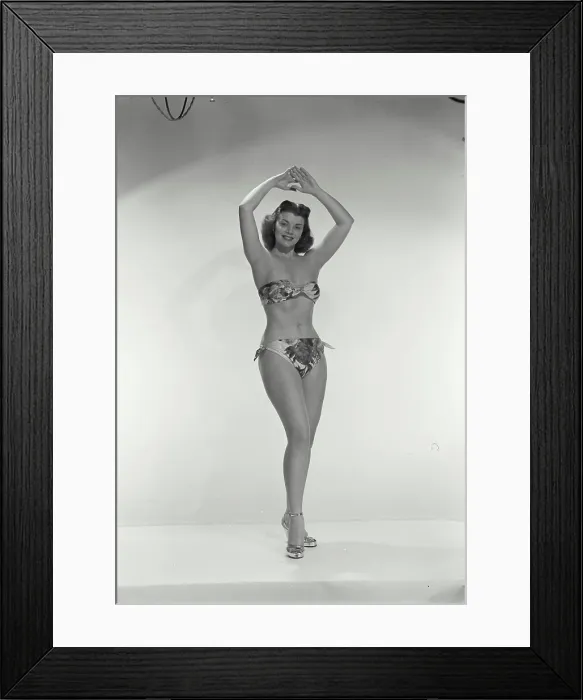 Framed Print : Vintage Photograph. Young woman in bikini with arms above head